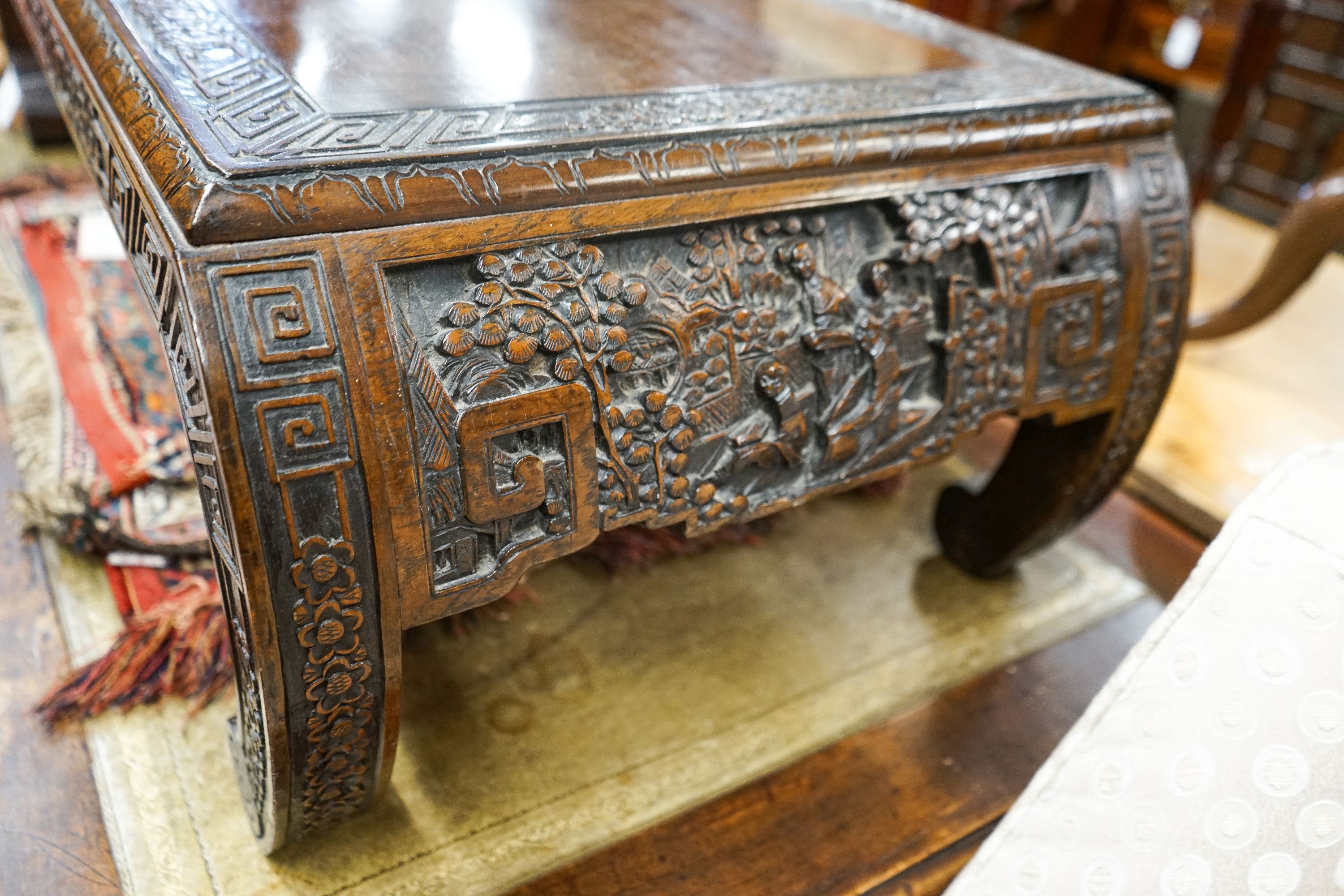 A Chinese rectangular carved top hardwood table, width 104cm, depth 46cm, height 29cm